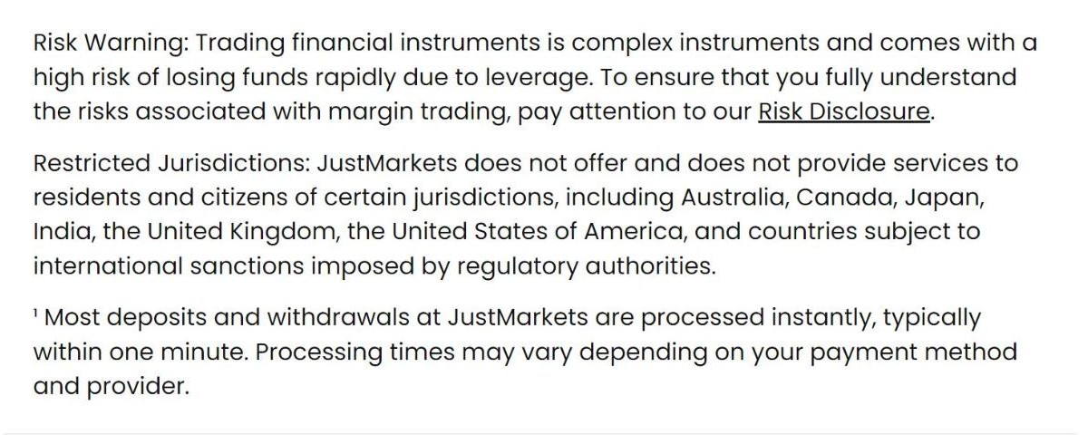 JustMarkets risk warning and restricted jurisdictions in the site footer